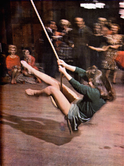 1963, Girl at party uses rope swing