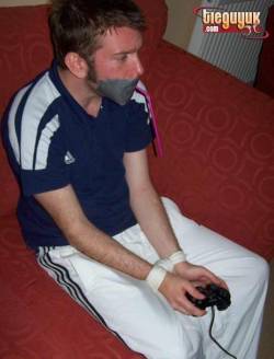 bondageman007:  Michael’s kidnappers were surprisingly accommodating. They tied him up and started robbing him, but first they put a XBox controller in his hand and a straw in his mouth… 