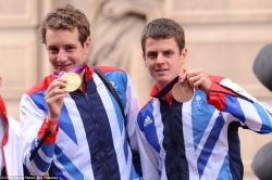 rachelsimmo:  Alistair and Jonny Brownlee on their float at the Olympics parade today 