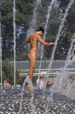 Naked in a fountain in public