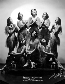 burleskateer:   Helen Reynolds and her World’s Champions Helen Reynolds’ champion skating team poses for a formal studio portrait, as lensed by James J. Kriegsmann in 1938.. This showgirl troupe performed regularly on the Burlesque theatre circuit,