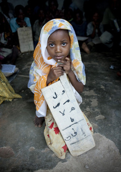 souls-of-my-shoes:  Veiled young girl in a Madrasa, Tanzania [by Eric Lafforgue] 