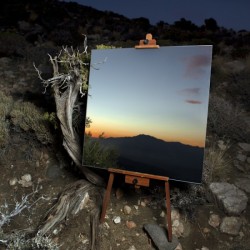 ryandonato:  The Edge Effect is a project by Daniel Kukla where he used large mirrors on easels to create an illusion of desert landscape paintings. 