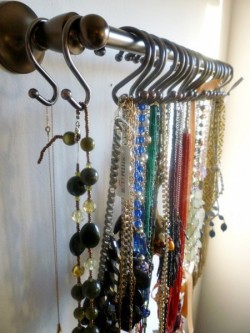 Great idea for necklace storage using shower curtain hooks and a metal rod!