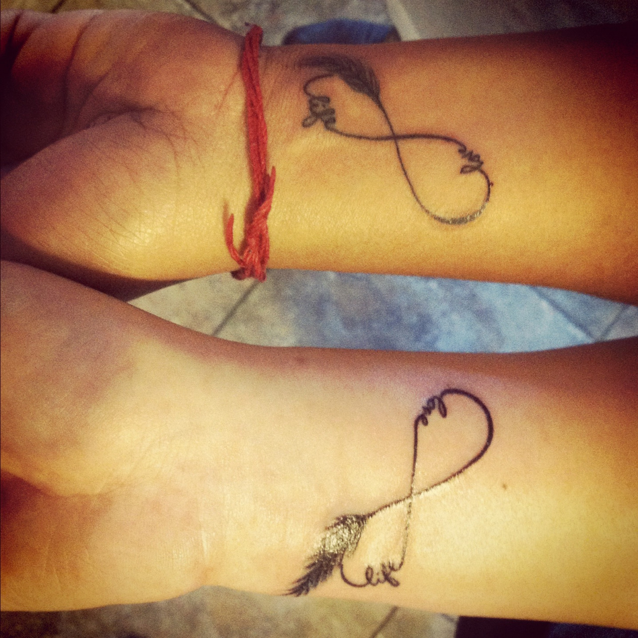 Couple matching heart and key tattoo