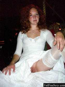 redheadspics:  Sexy ginger redhead dressed all in white, spreading her legs with thigh highs.