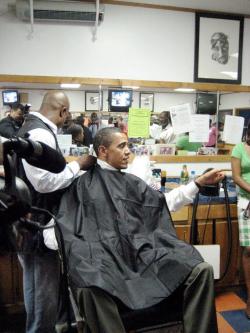 thuglife-thugzmansion:  mrmoses717:  President Barack Obama getting a haircut &amp; talking to supporters. 2pac hanging on the wall……    