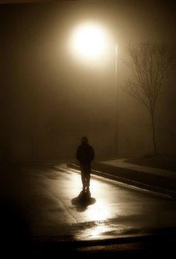 Man walking down the street at night