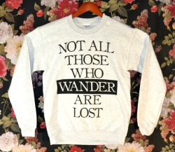 the-absolute-best-gifs:  Wicked Clothes is proud to present their latest item: the ‘Those Who Wander’ Sweater! This ash grey sweater will keep you warm all winter long. On top of being on sale for a limited time, use coupon code ‘1000NOTES’ for