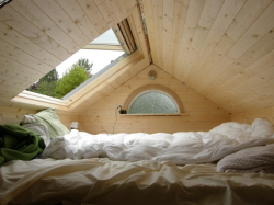 nymphical:  luhstire:   i would never leave this bed    perfect  I just imagine making that into a giant nest of warm blankets and watching rain fall down on the roof  I WANT THIS SO BAD Stargazing would be amazing in a room like this!!!! (if it was far