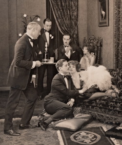 clarabowarchive:  Queen of the Twenties Scene ☆ Clara Bow on the couch with Allan Forrest on the floor ☆ Two Can Play (1926) ☆  