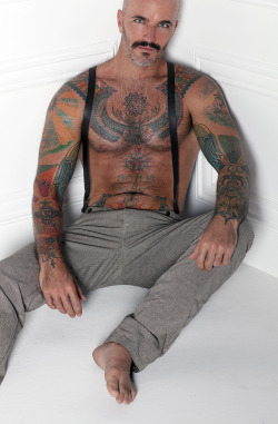 Tattooed chest, with amazing nipples and suspenders