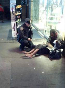 winterof95:   whatifeverythingisadream-deacti:  This NYC cop saw a homeless man outside of the shoe store, knowing the weather was cold and getting worse he went inside to buy a pair of boots for the man.This cop deserves some respect  See? This is when