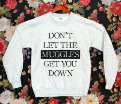 the-absolute-best-gifs:  BACK IN STOCK: the ‘Don’t Let the Muggles’ Sweater! These flew off the shelves last time, so you need to order now if you want one! This lovely ash grey sweater will keep you warm all winter long. On top of being on sale